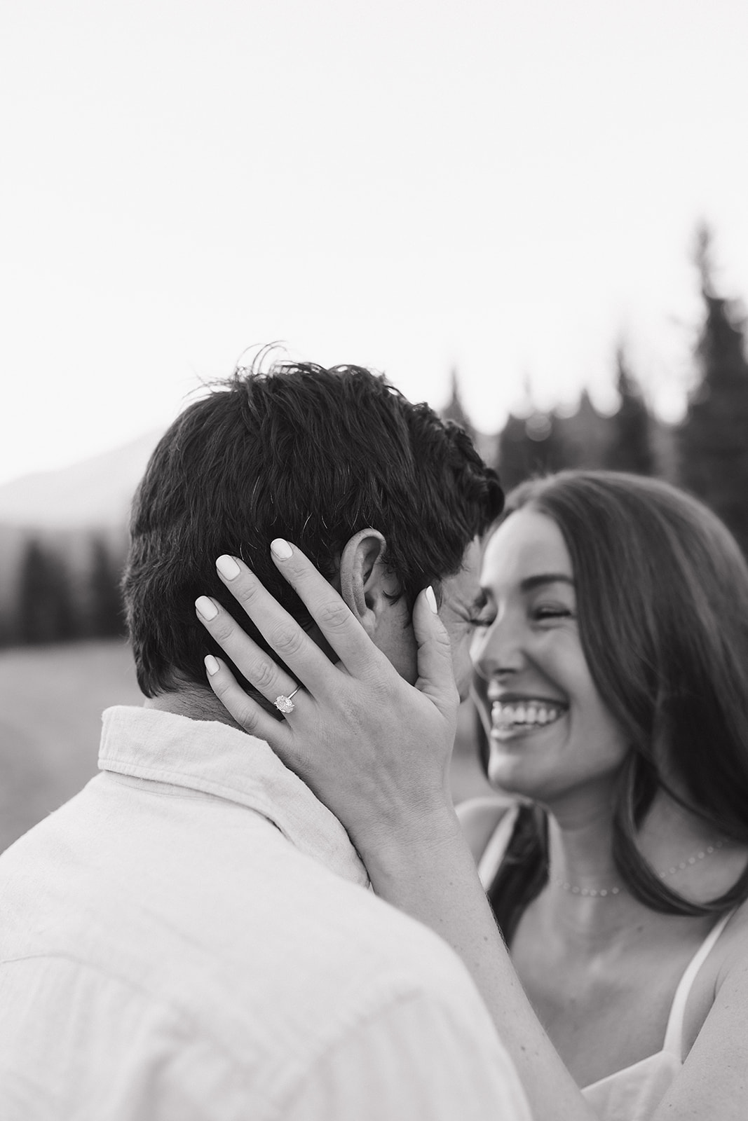 In-love smiling couples portrait session in Evergreen Colorado mountains