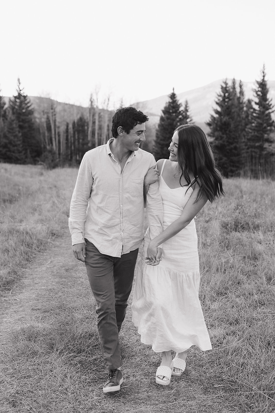 in-love couples engagement photography in Colorado's picturesque mountain range background