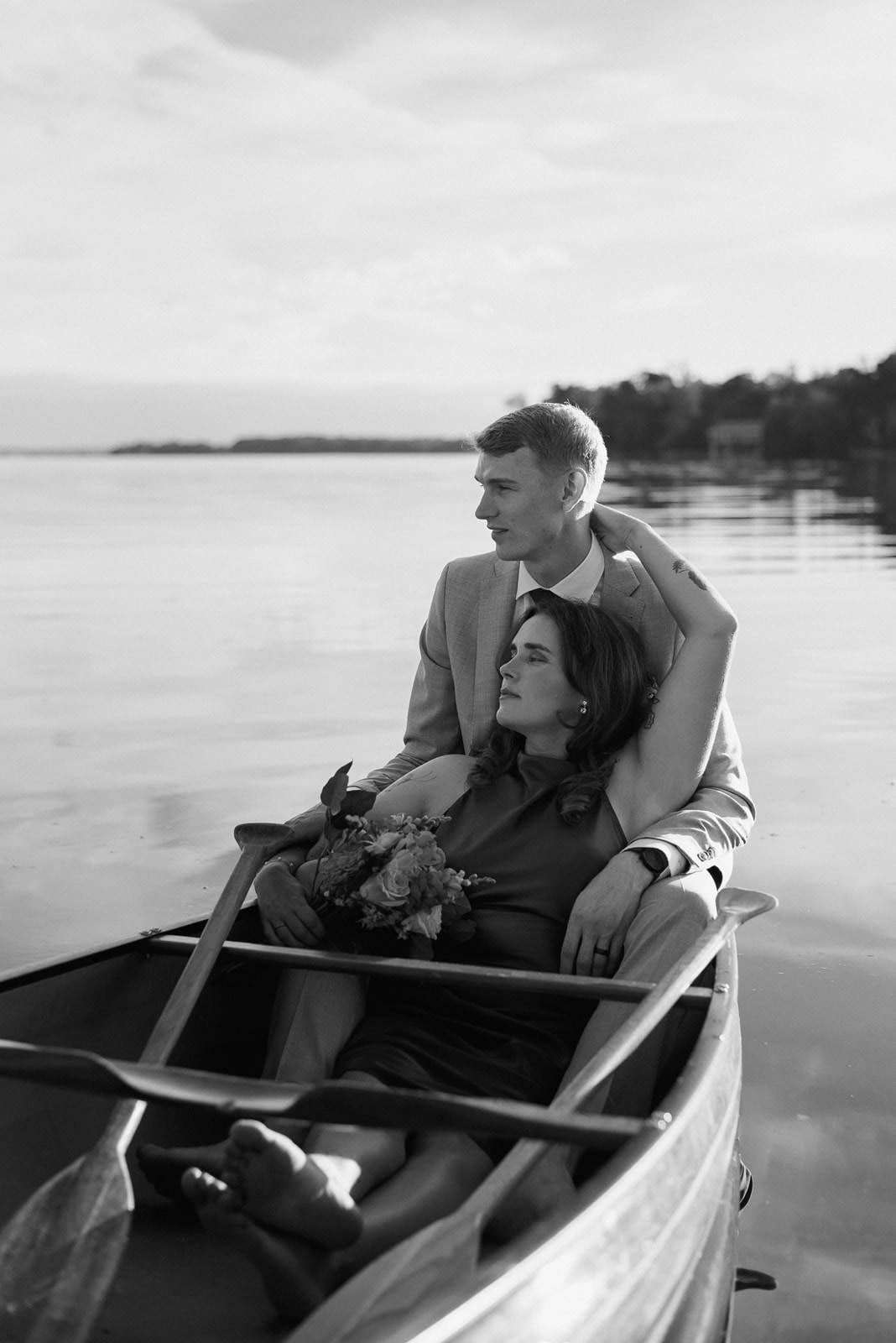 a bride and groom portrait in a canoe on lake couchiching, Ontario