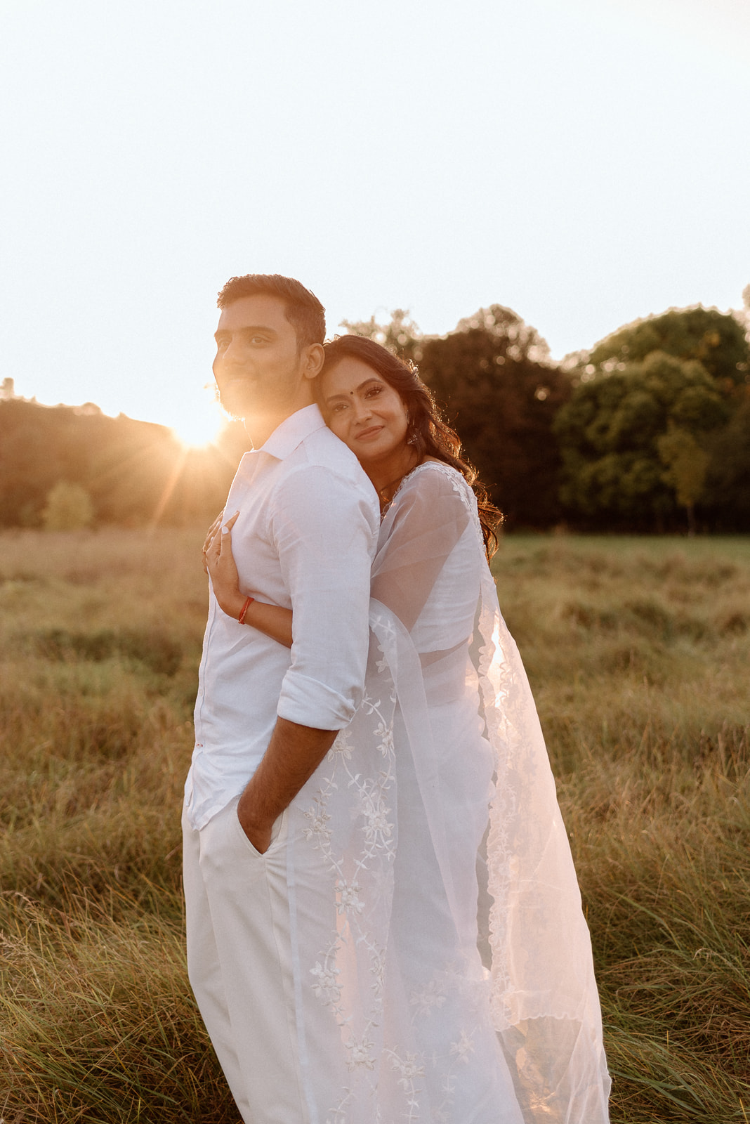 An engaged couple in simcoe county during sunset. Muskoka wedding photographer