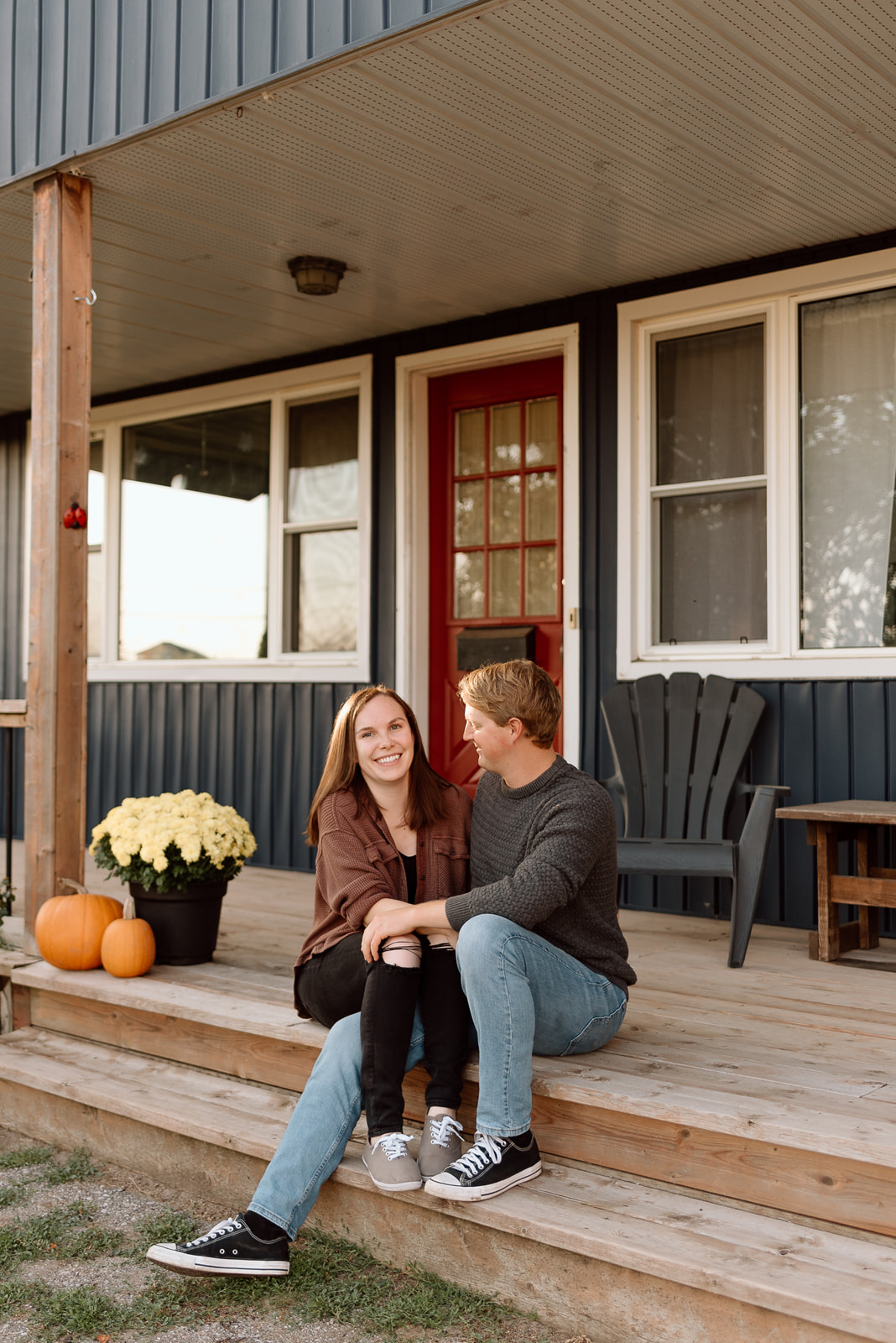 An engaged couple outside their home near Barrie, Ontario. 
