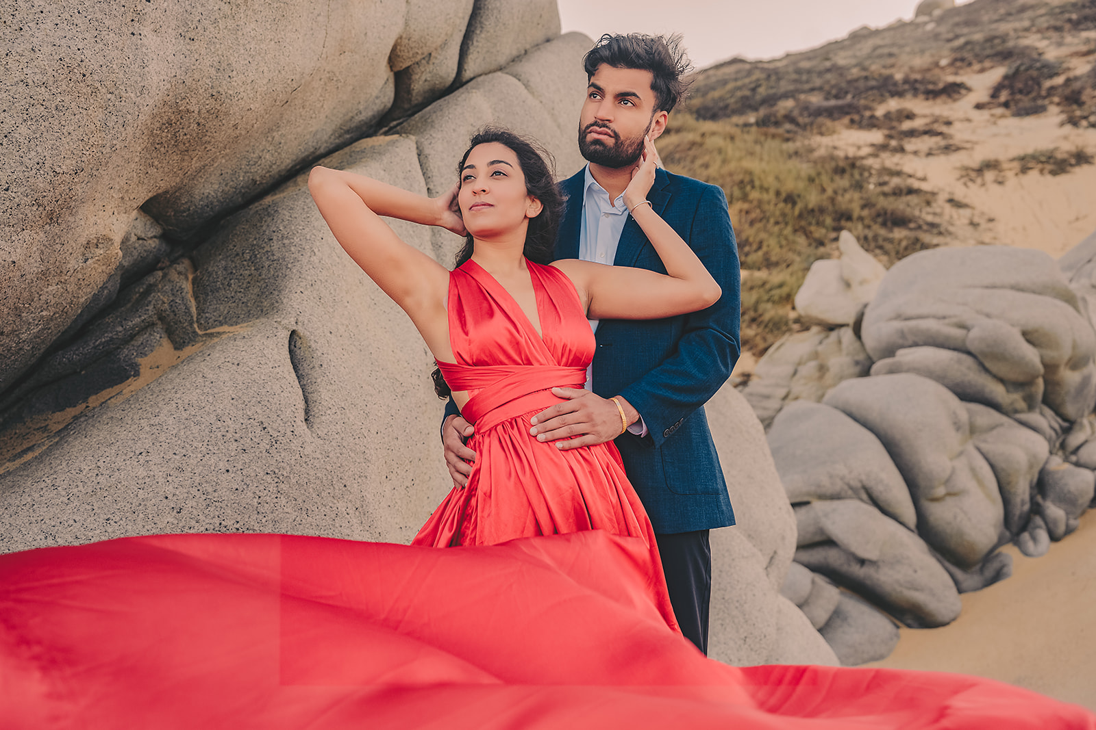 Los Cabos beach engagement photo shoot in red dress