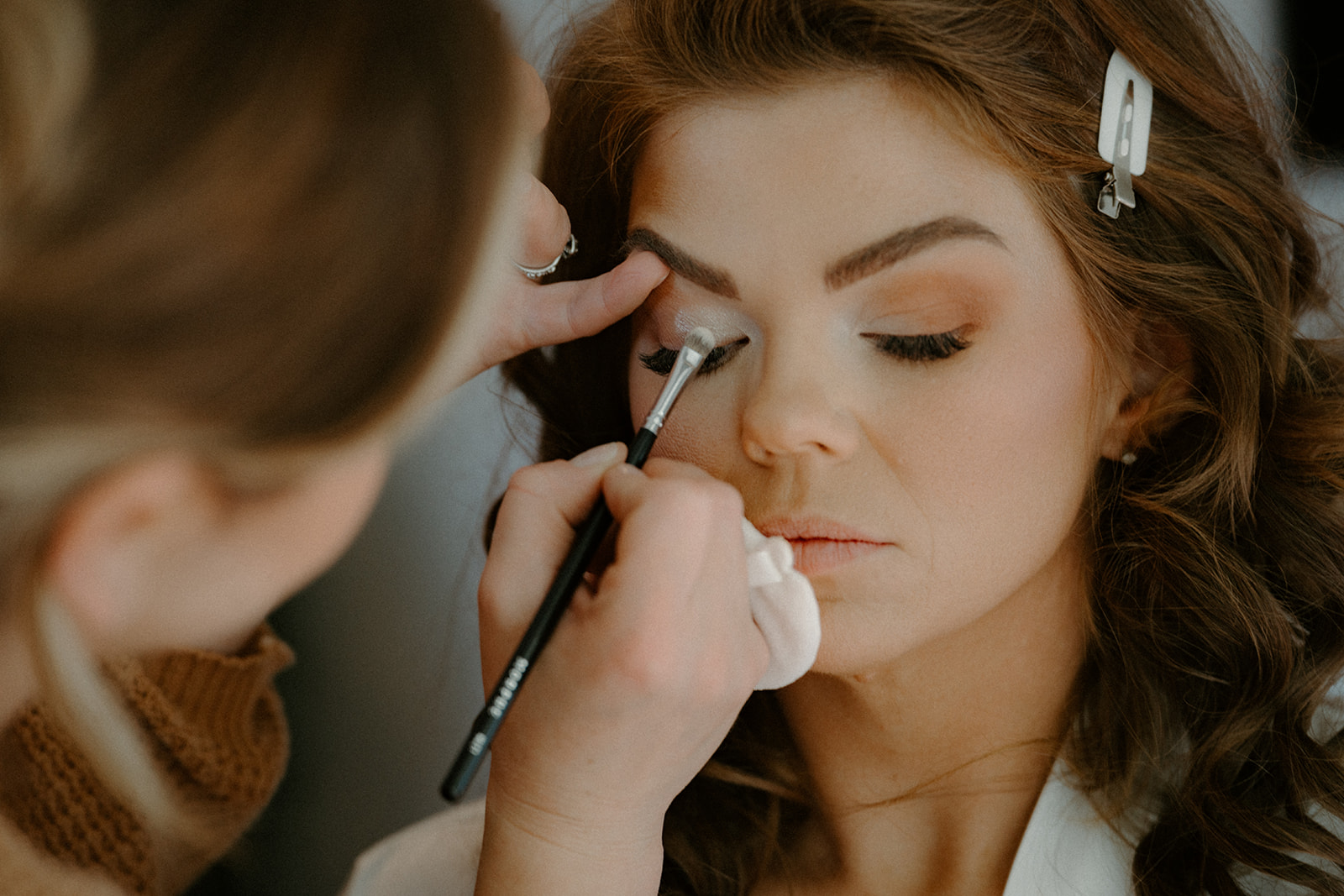 Bride getting ready for her fall wedding in the Okanagan at the Laurel Packing House