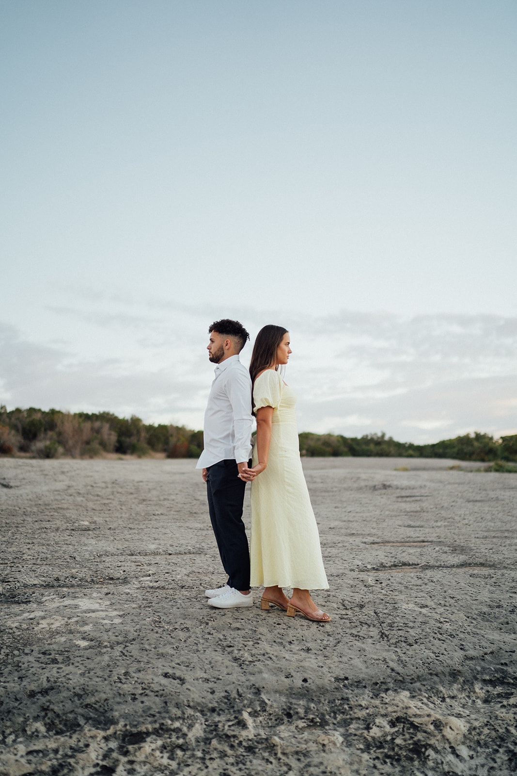 Taryn and Gavin embracing during their engagement photos at McKinney Falls