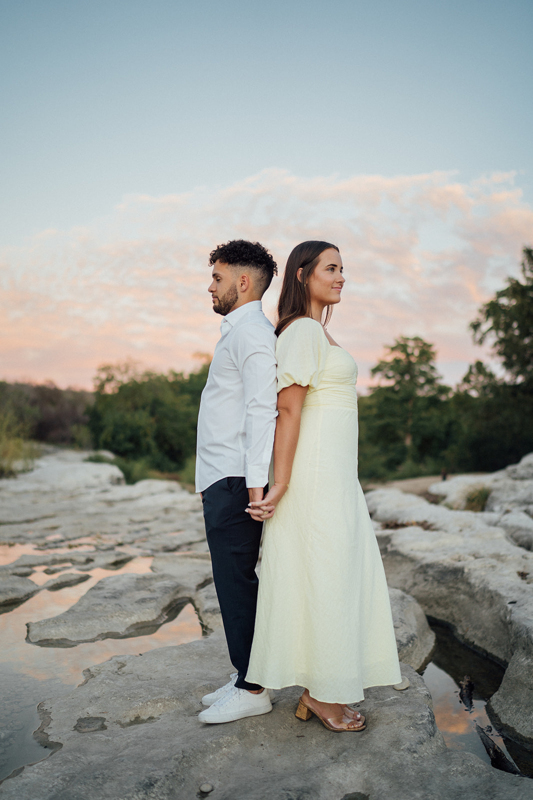 Taryn and Gavin embracing during their engagement photos at McKinney Falls