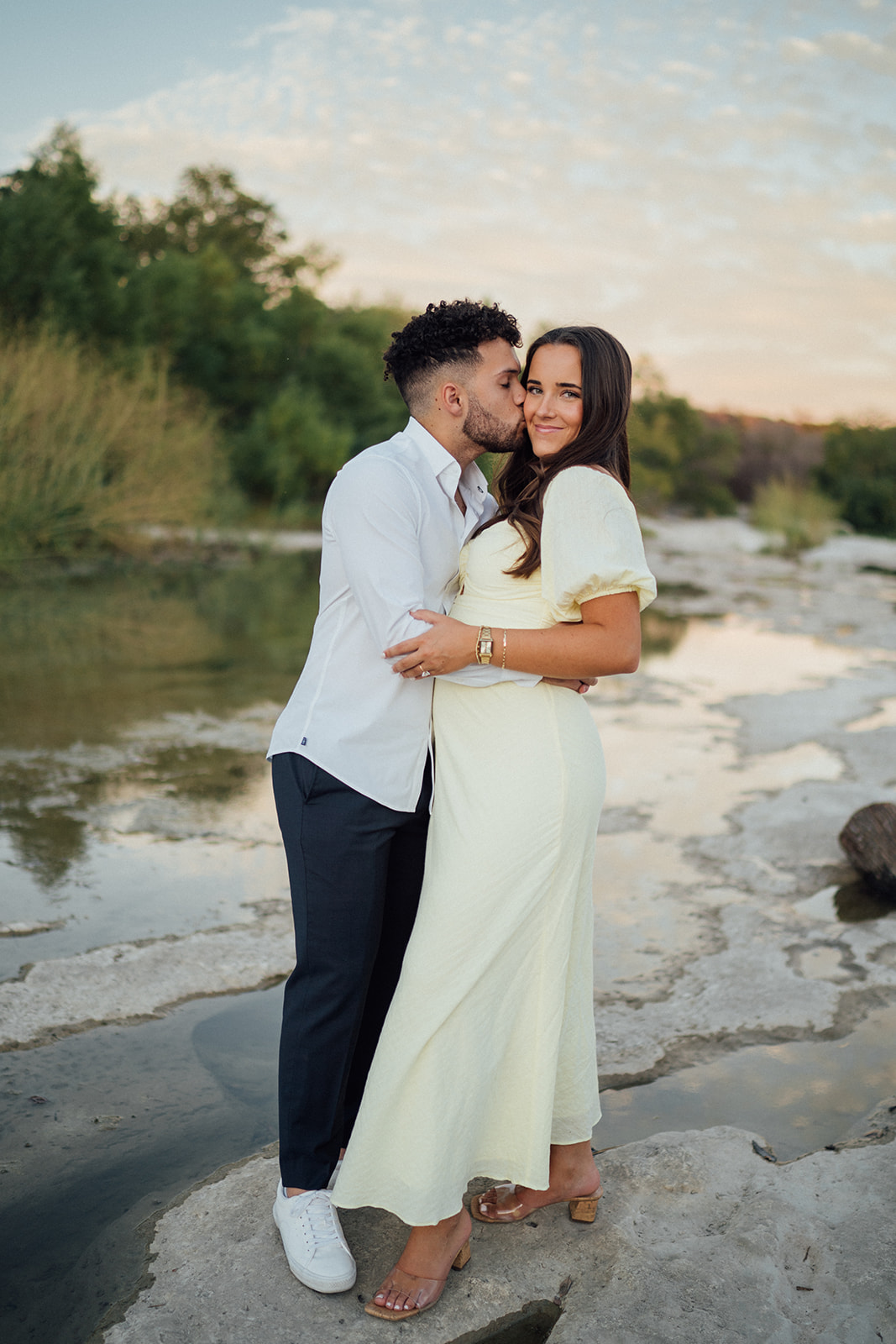 Taryn and Gavin embracing during their engagement session at McKinney Falls