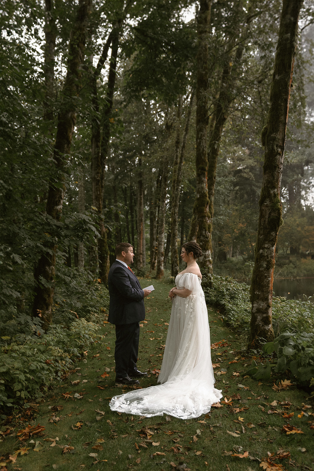 Bride and groom reading private vows at a misty Bridal Veil Lakes wedding