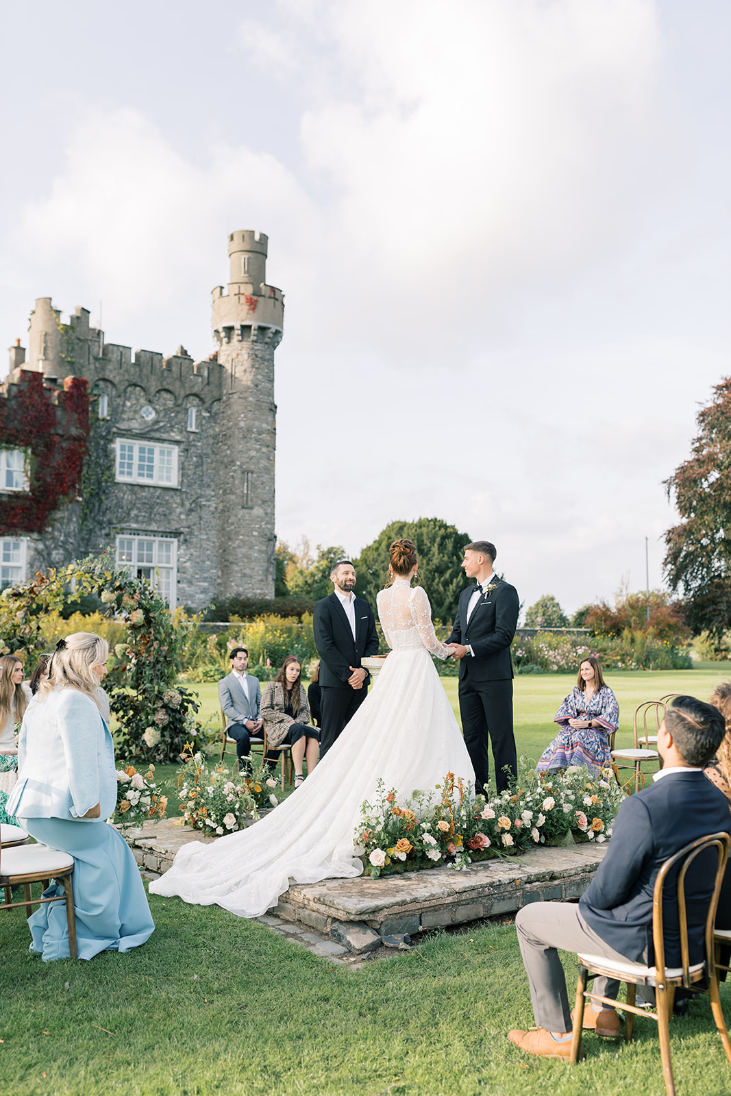 bride and groom exchanging vows at wedding ceremony at luttrellstown castle resort