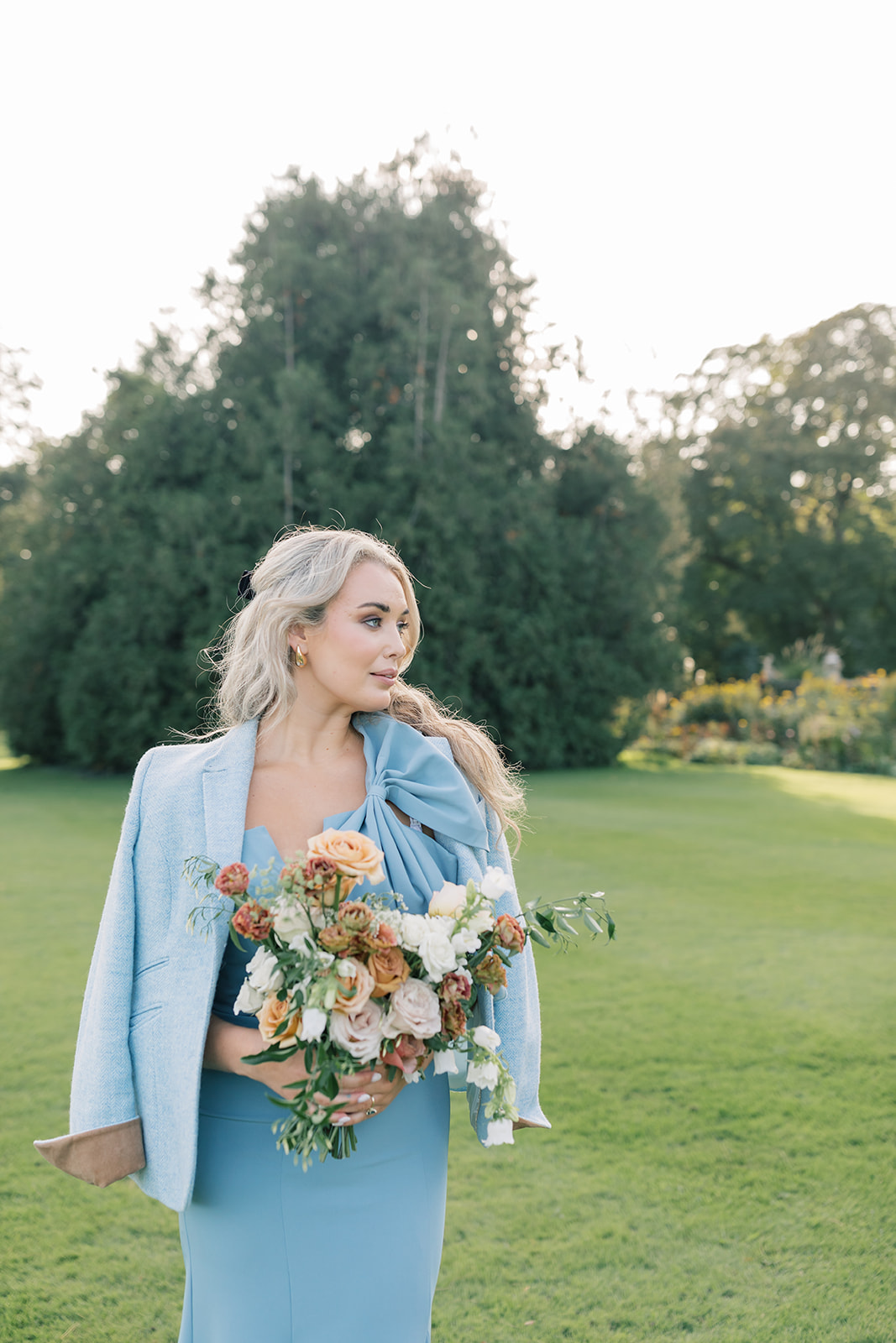 bridesmaid dressed in blue at autumn wedding at luttrellstown castle