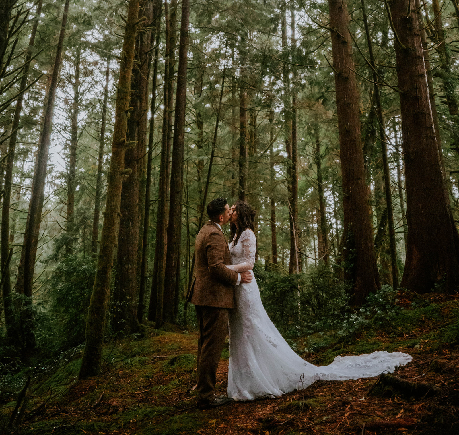 Bride and groom facing each other in the trees at Salishan Coastal Lodge on the Oregon Coast