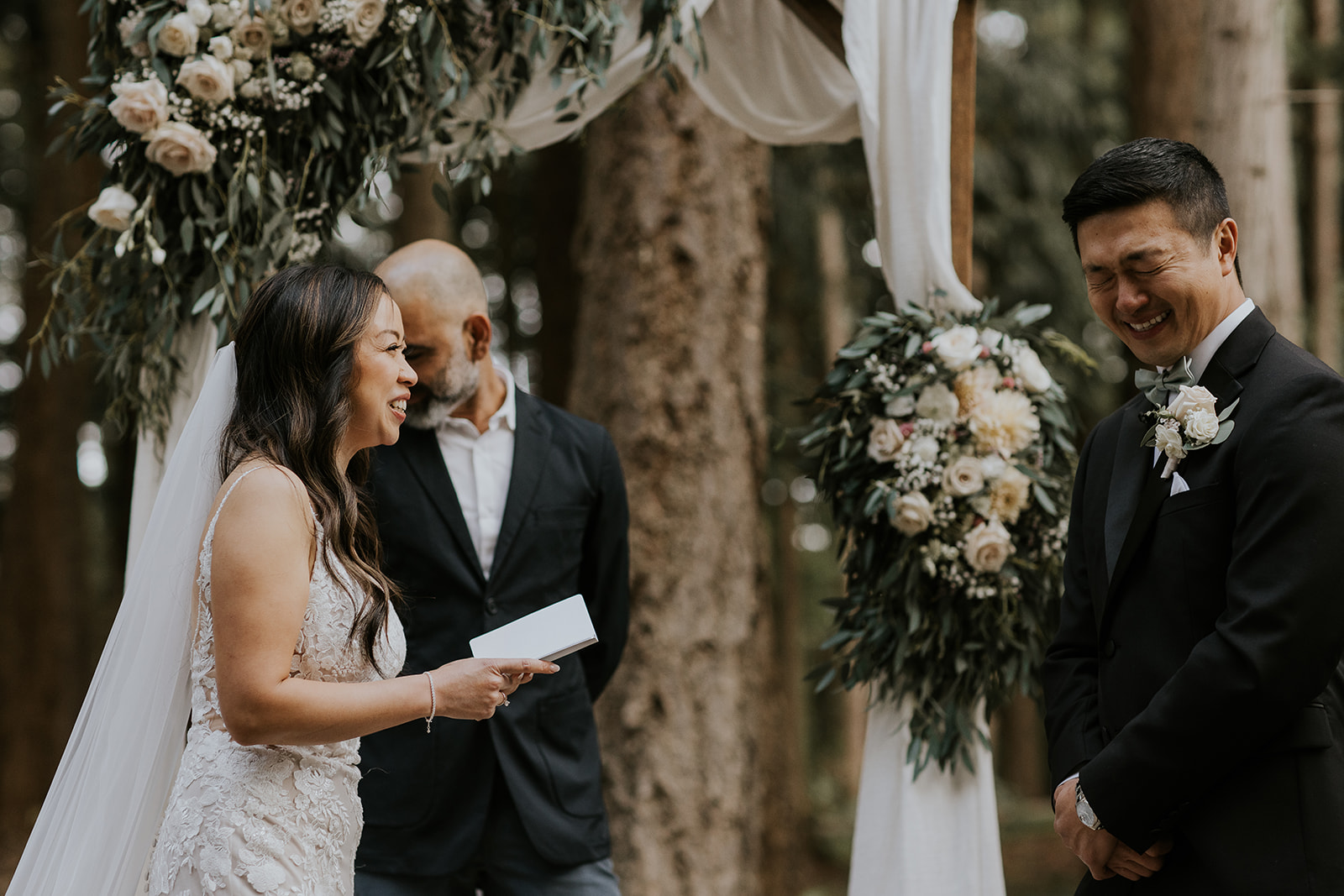 a bride and groom read each other vows 