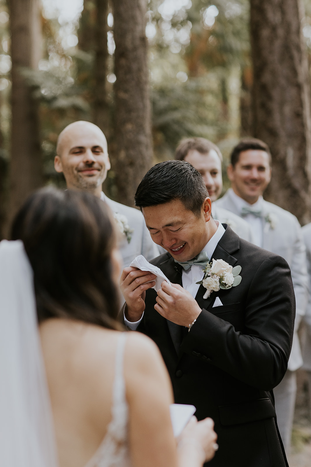 a groom cries at the altar