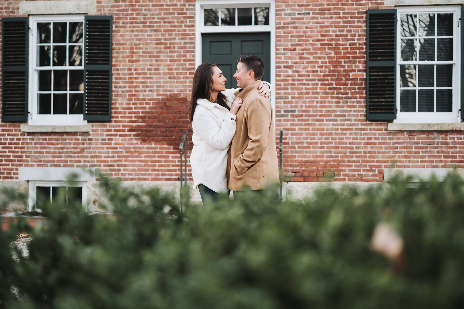 same sex couple intimate and fun engagements fall sunset session at the historic Boott Cotton Mills Museum 