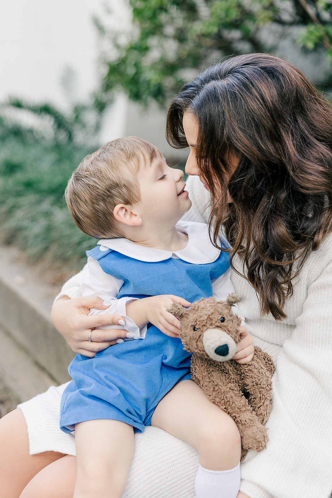 Family photos with toddler boy in classic blue and white colors at Goodwood Museum