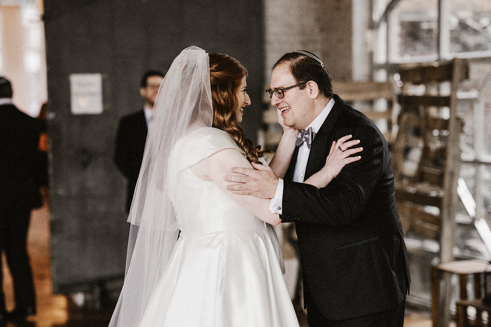 bride and groom having first look for their modern orthodox jewish wedding at the art factory