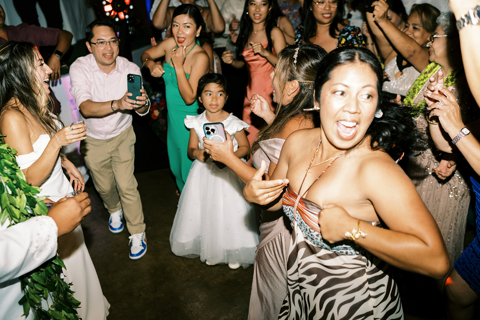 Guests dancing and enjoying themselves at a lively Hawaiian Wedding reception in Kauai