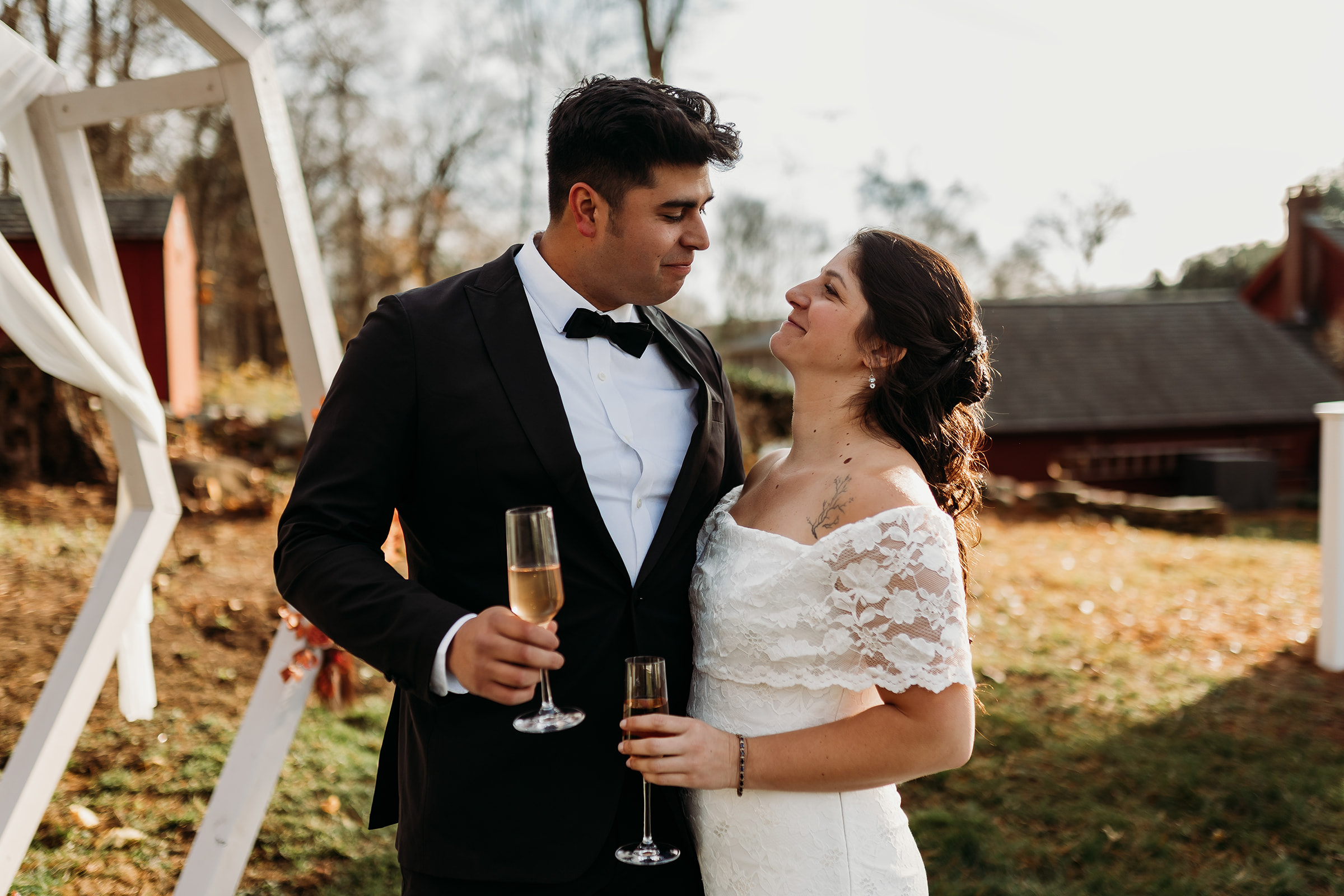Bride and groom sharing a tender moment during their intimate Connecticut wedding ceremony