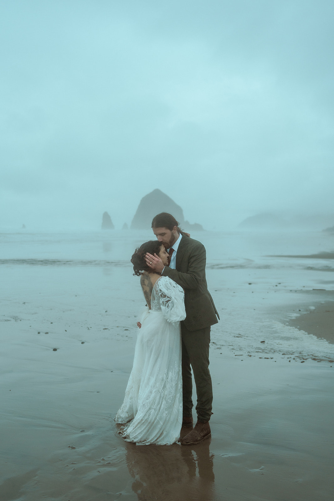 Cannon Beach elopement at Haystack Rock on Oregon's foggy, moody coast near Astoria, Oregon