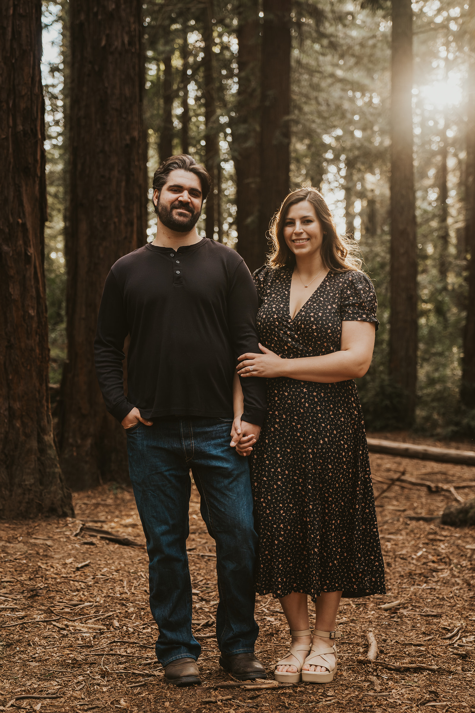 Newly engaged couple poses in the Oakland Redwoods