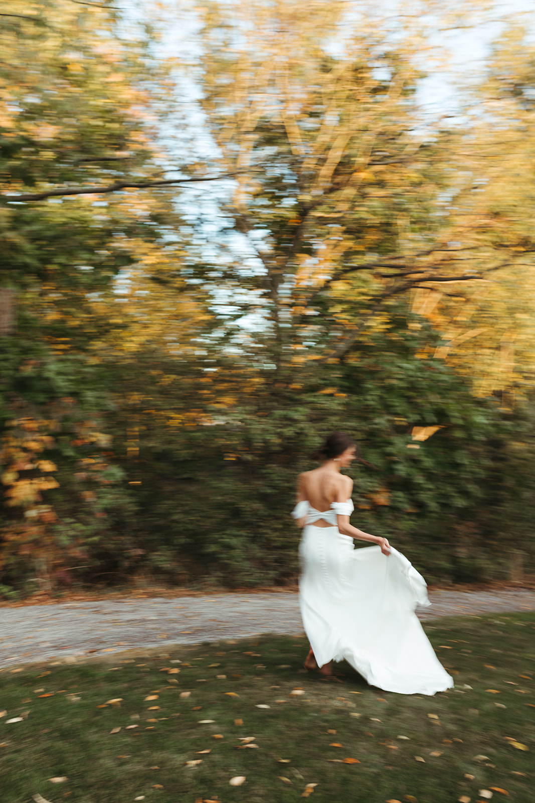 A whimsical bride dances on her wedding day in Virginia.