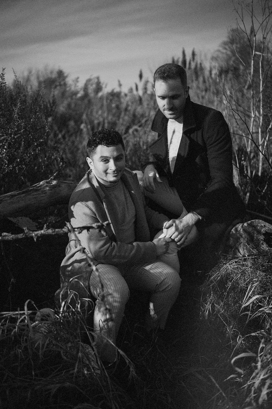 editorial style black and white photo of gay couple in the woods during nj engagement session