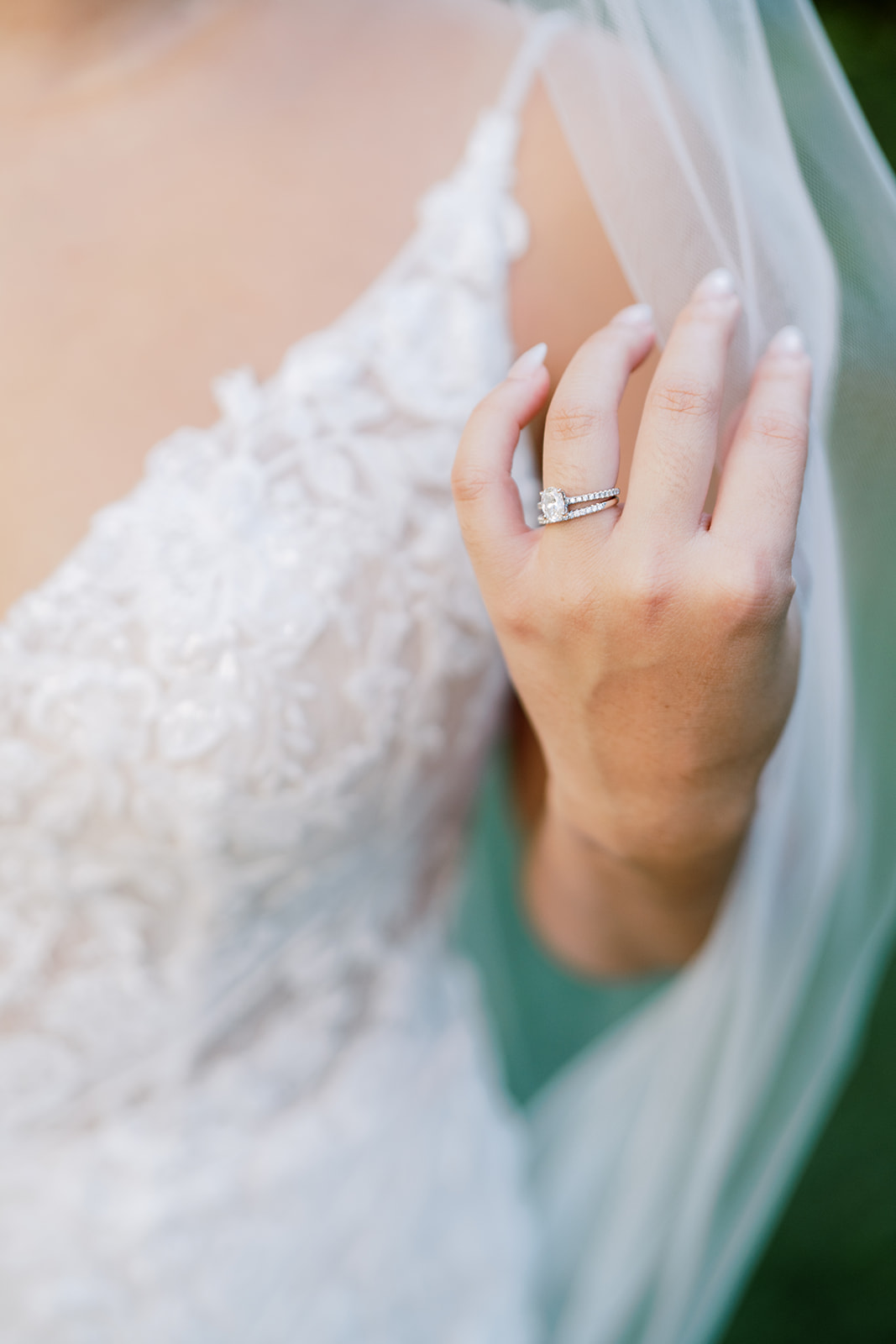 A bride with her wedding ring on her hand photo taken by Megan Moura Photography