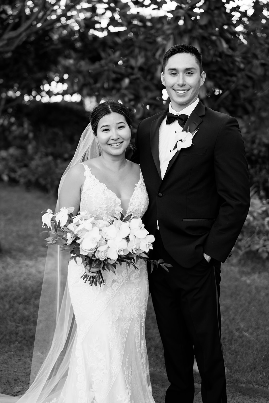 A monochrome photo of the newlyweds taken by Megan Moura Hawaii Photographer.