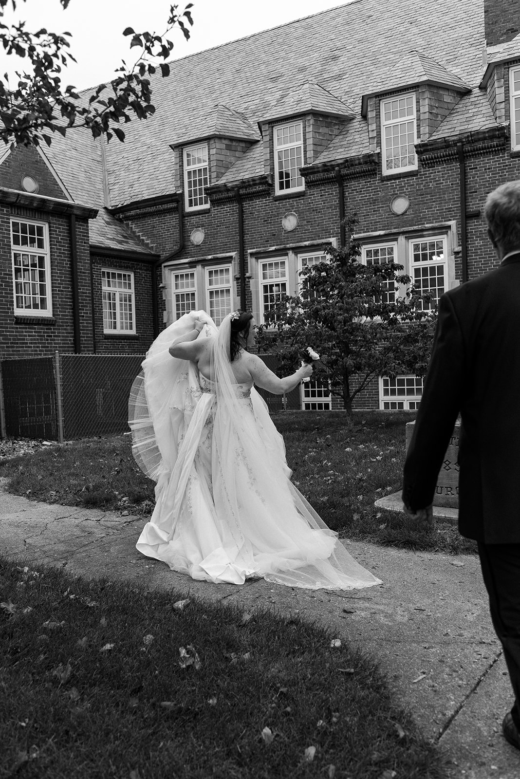 black and white detail image of wedding dress in motion