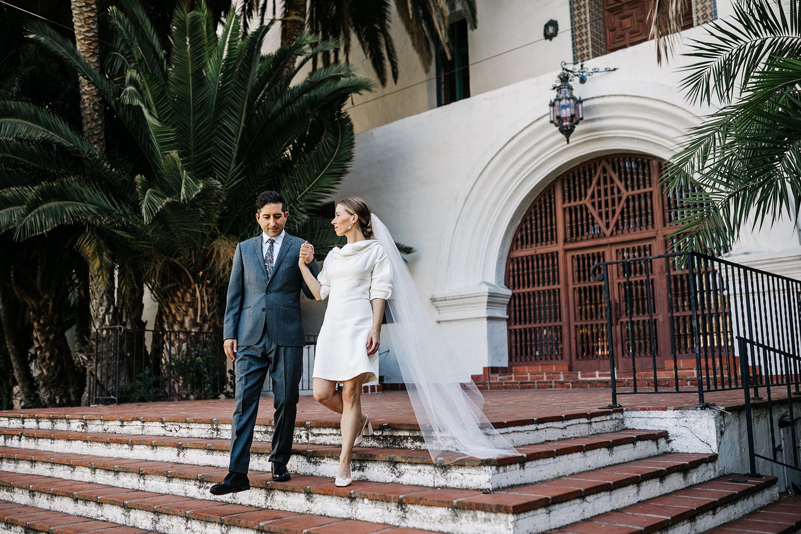 Bride and groom portrait Santa Barbara Courthouse staircase
