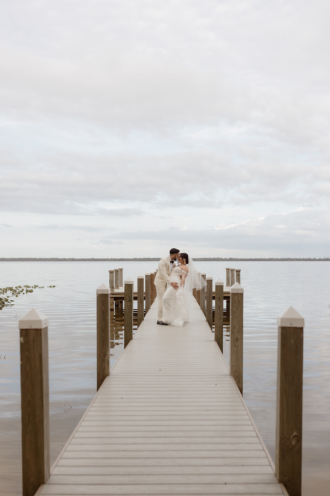 Bride and groom portraits at Bella Cosa lakeside Lake Wales, Florida