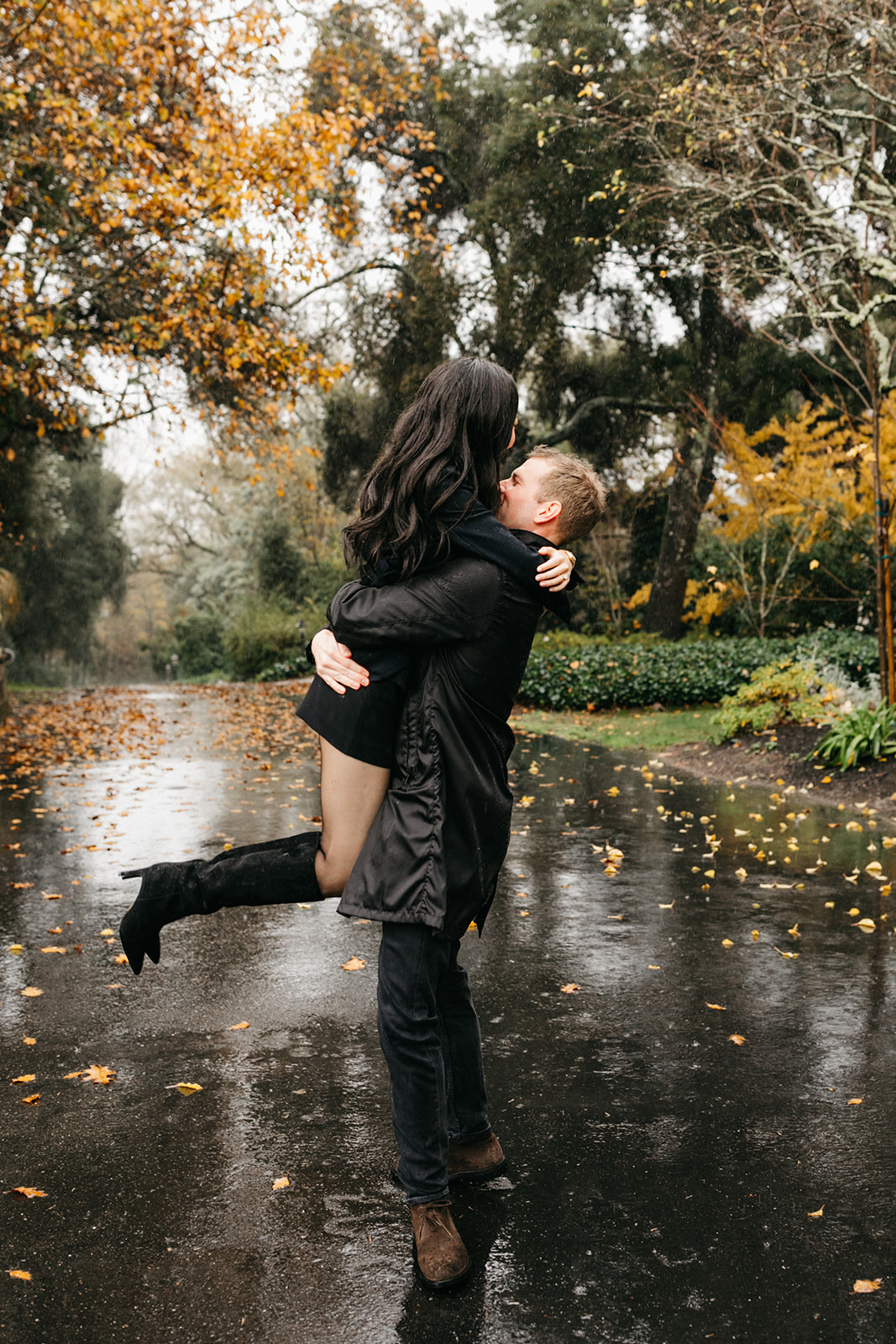 couple dancing and having fun in the rain at the madrona
