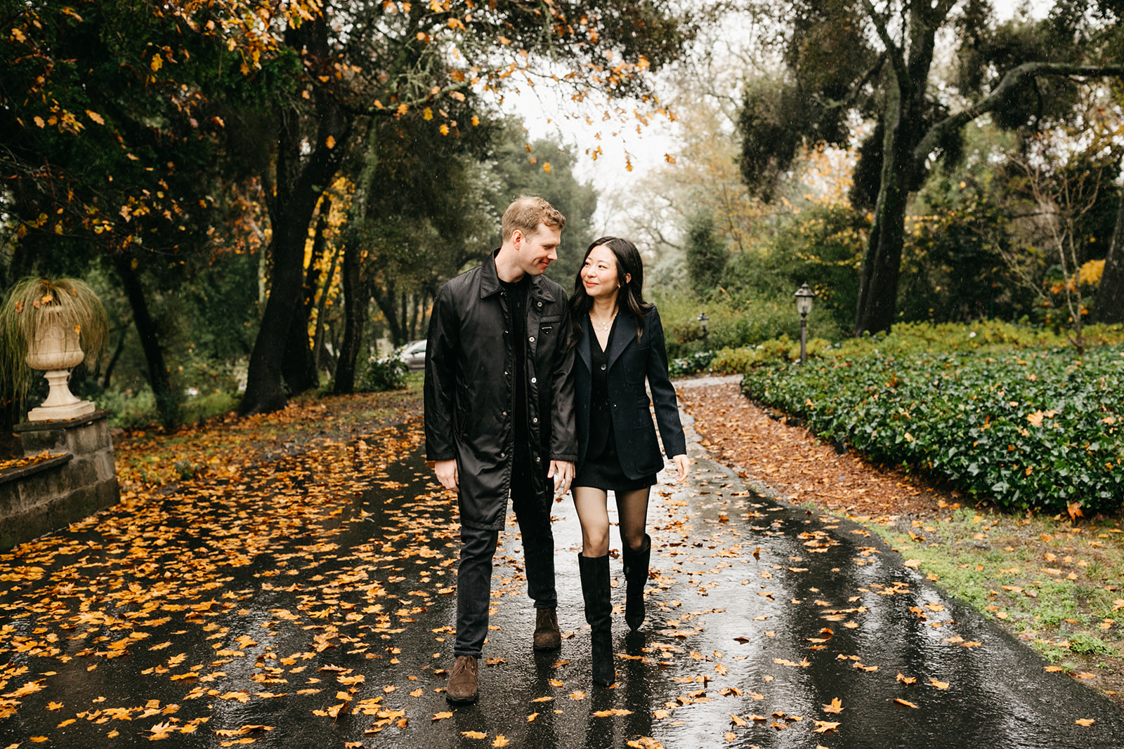 a couple walking in the rain together, engagement photos