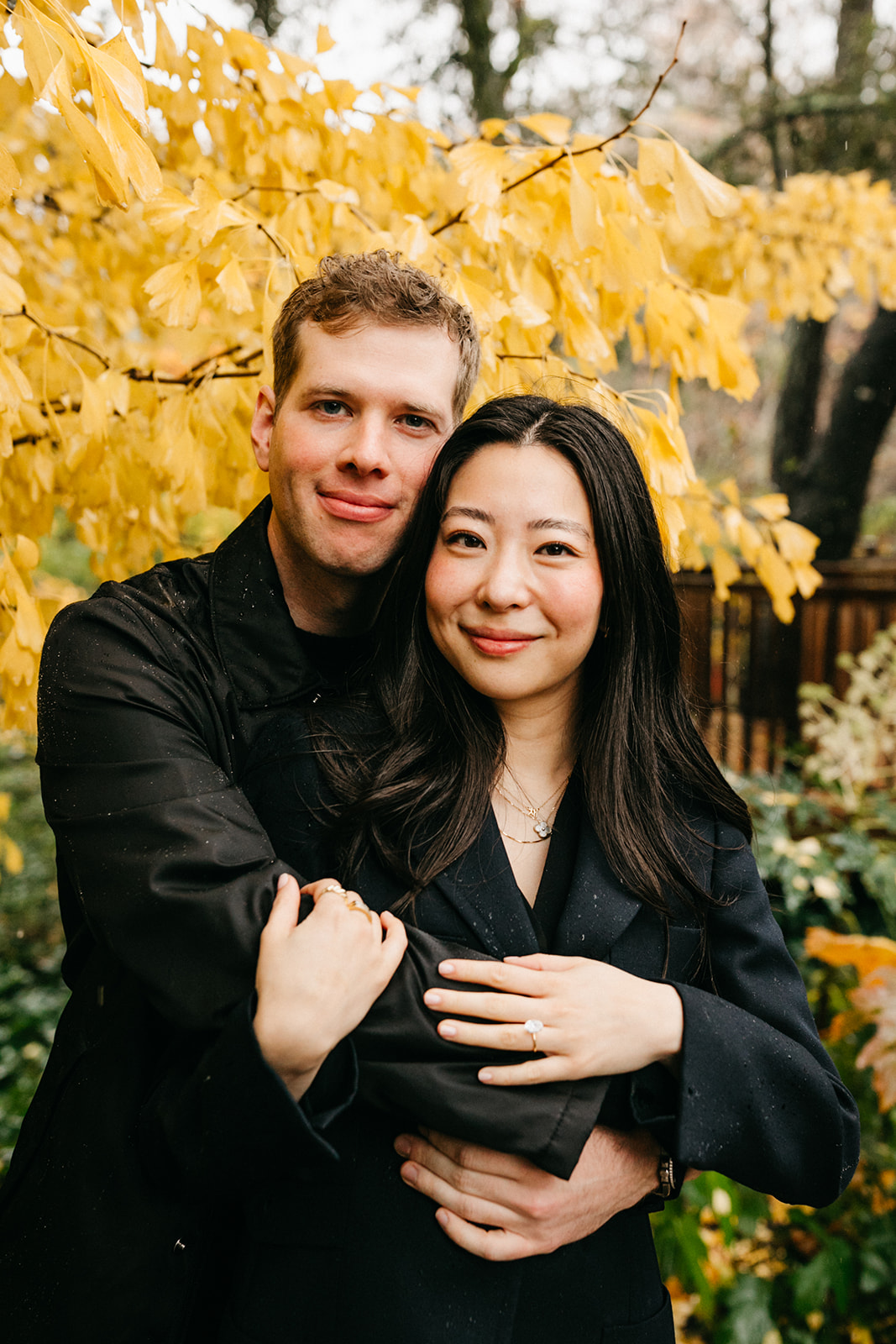 portrait of couple in front of yellow tree