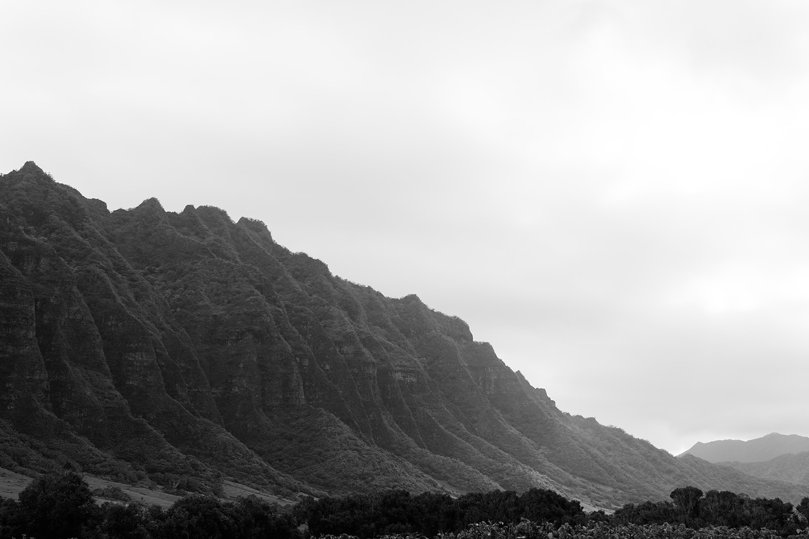 A black and white photo of a mountain in Hawaii, perfect for a Kualoa Ranch Wedding.