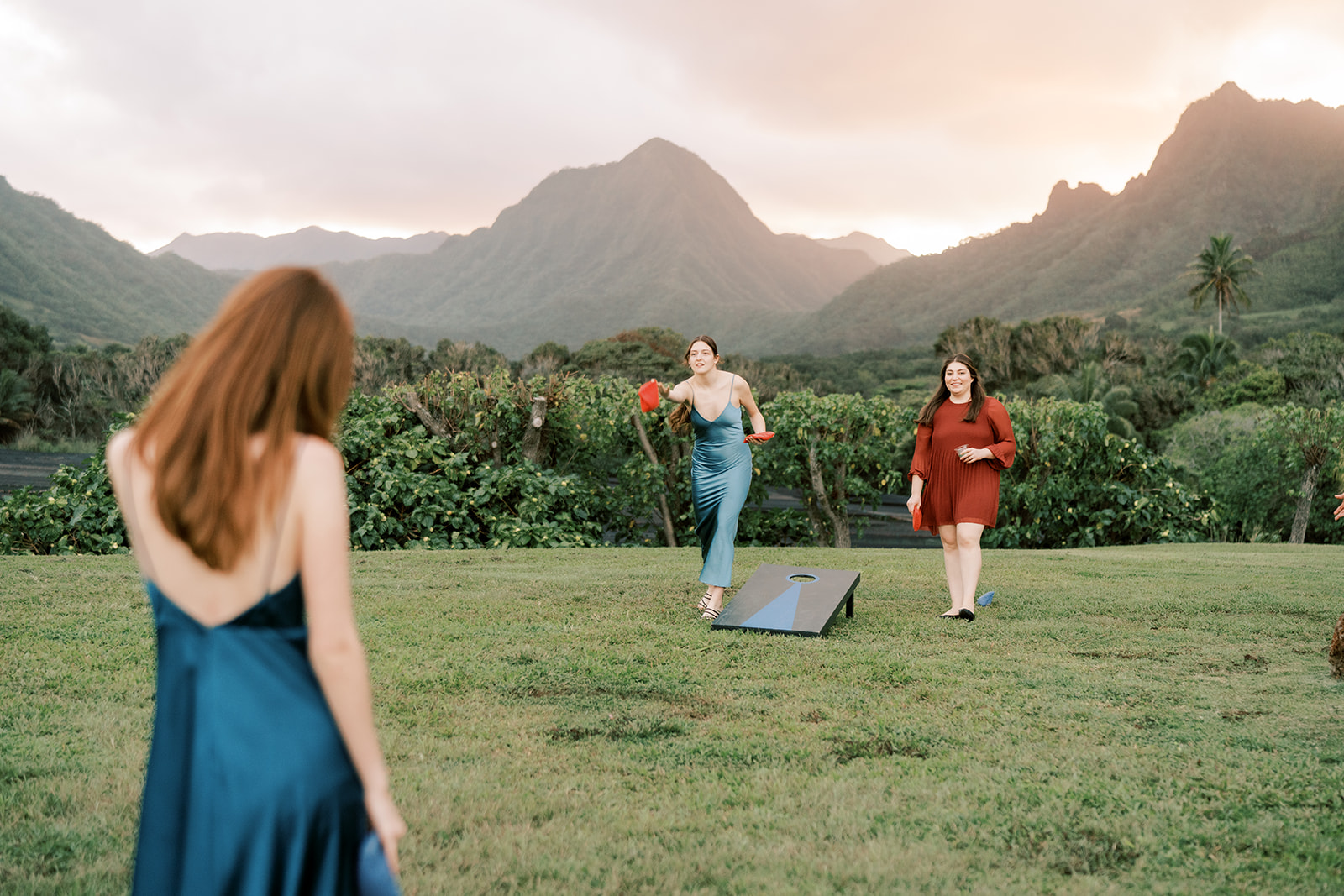 A group of people playing a game of croquet at a wedding.
