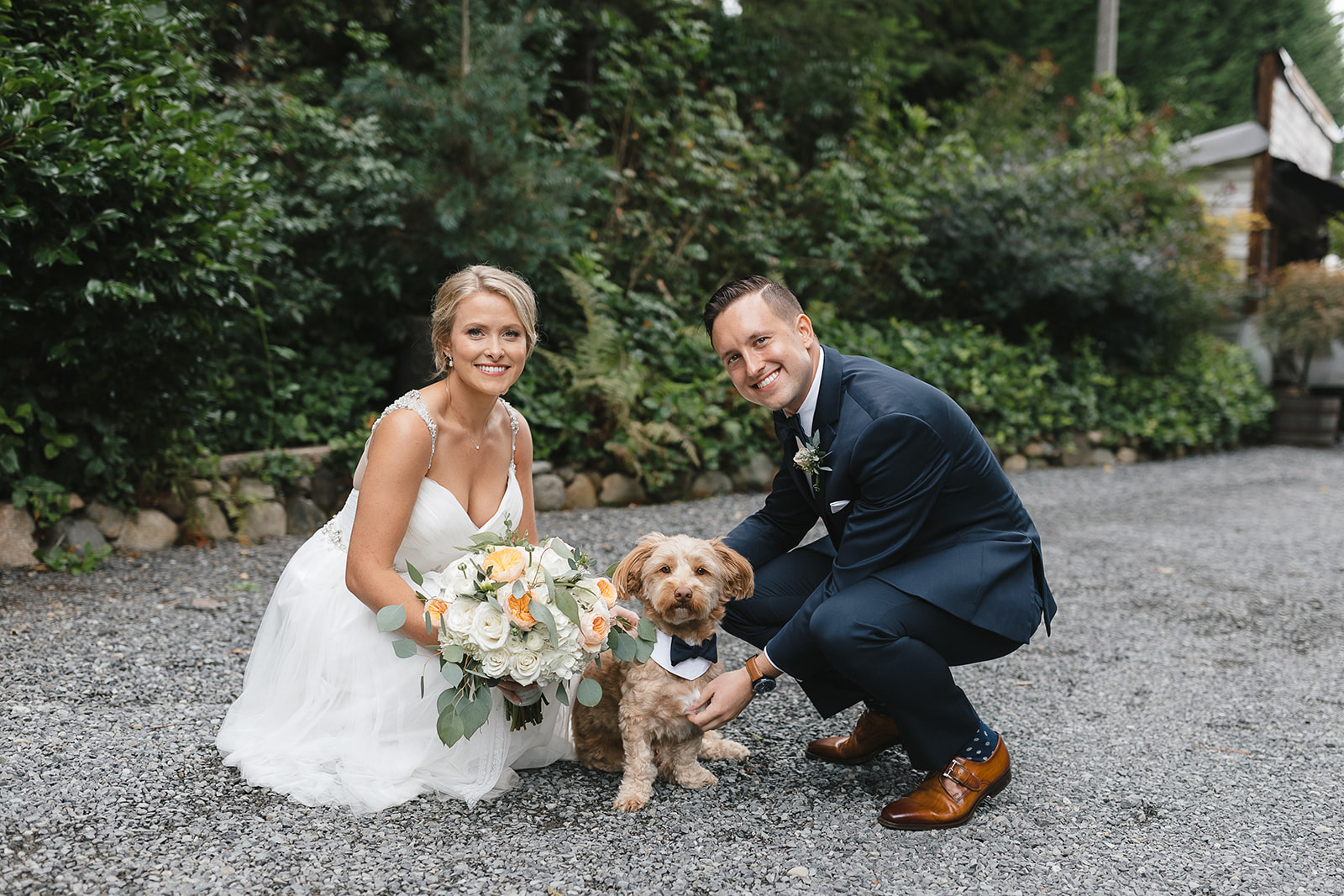 Bride and groom and their dog at a wedding in Green Gates at Flowing Lake in Snohomish.