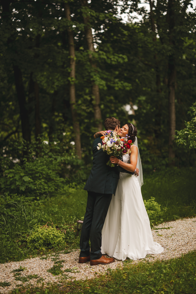 A couple embrace at their Berkshires wedding 