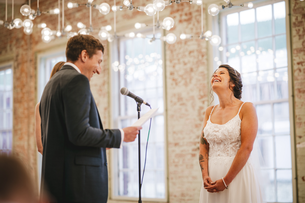MASS MoCA wedding ceremony in long gallery with twinkle lights