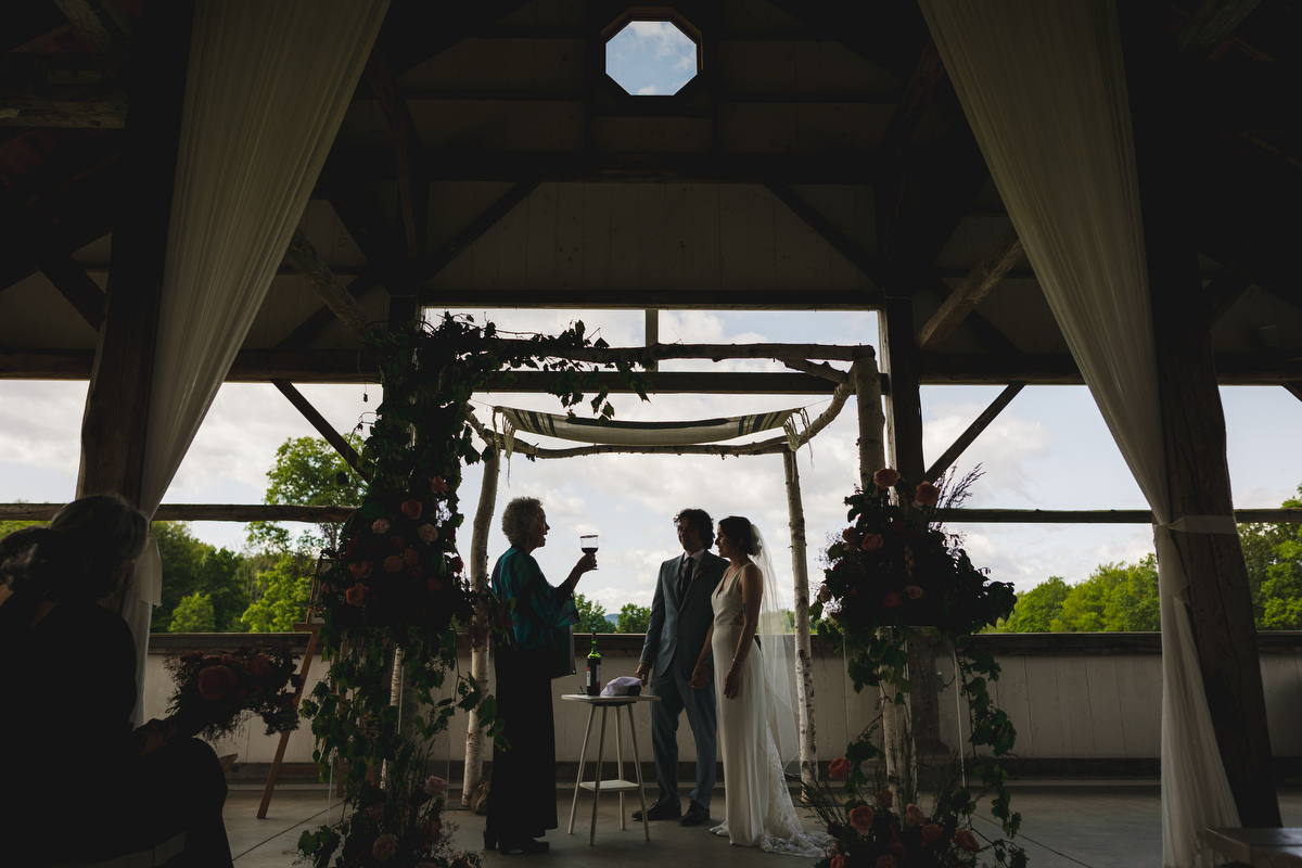 silhouette image of a wedding ceremony in the pavilion at valley view farm 