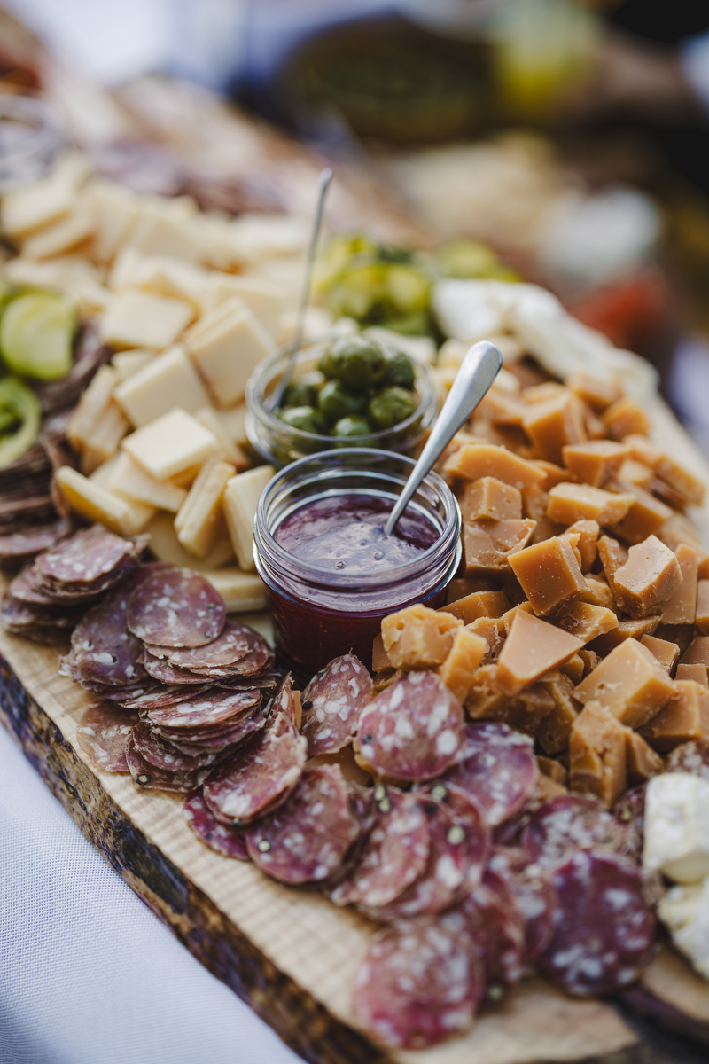 close up of a platter of meats and cheeses at a valley view farm wedding reception