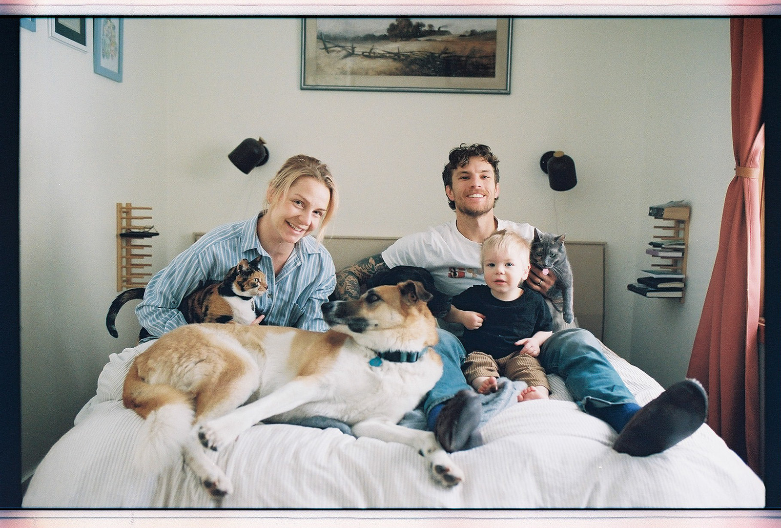 kelowna family film and documentary family photography at home, 35mm film, cuddles, baby bump maternity