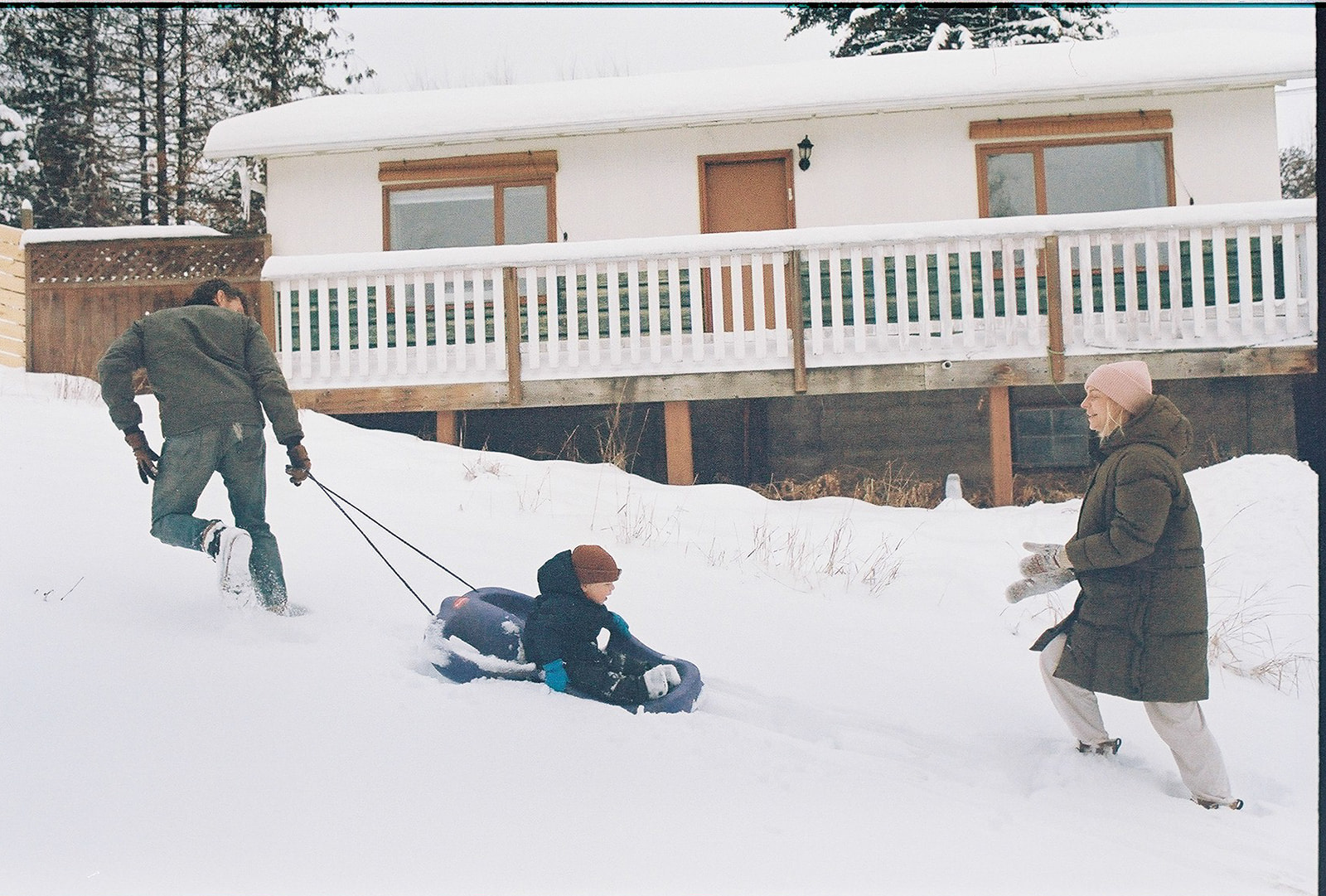 kelowna family film and documentary family photography at home, 35mm film, playing in the snow