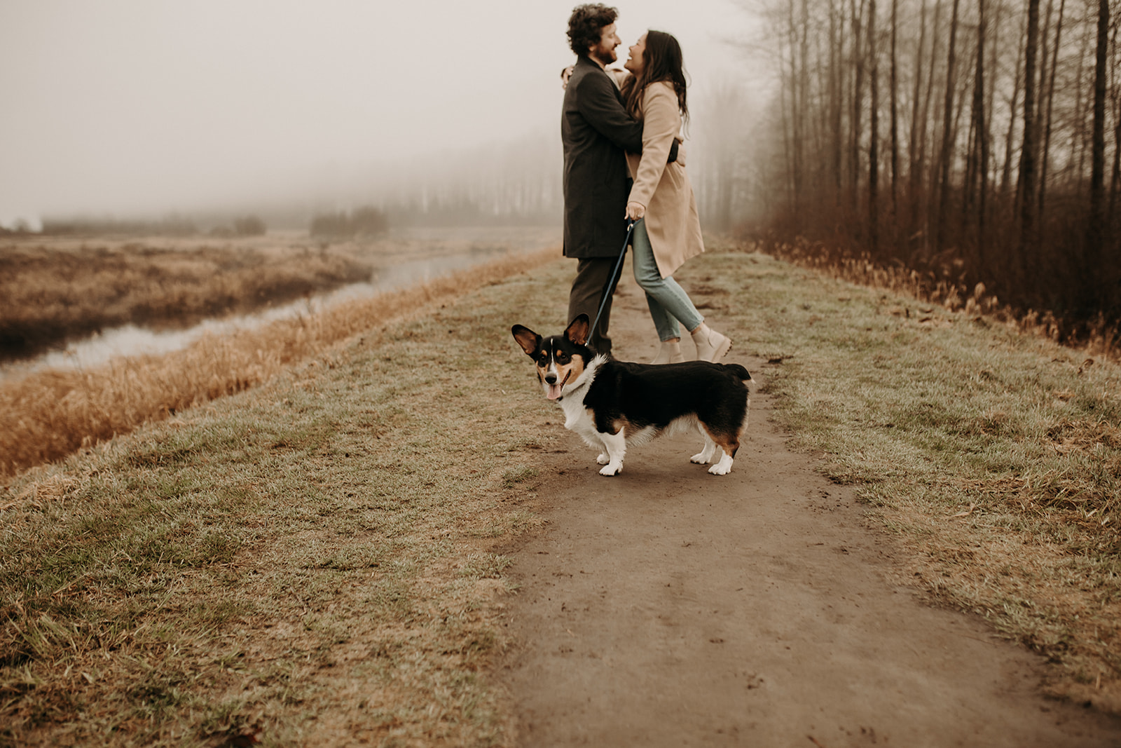 A couple having their engagement photos photographed by Pitt Lake in Pitt Meadows, BC