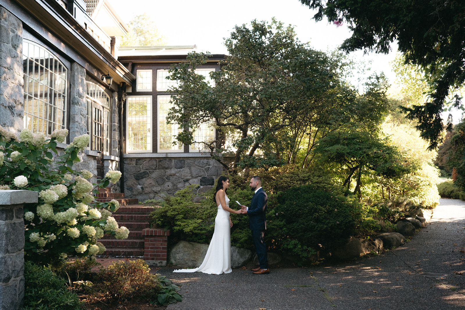 Bride and Groom sharing private vows before their outdoor weekday Vancouver wedding ceremony at Cecil Green Park House