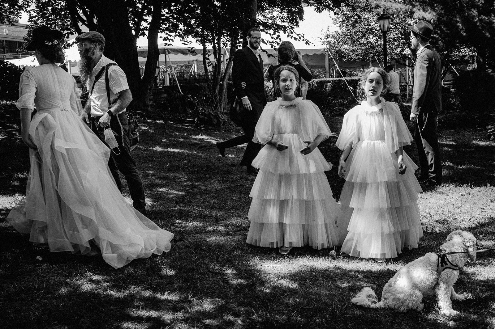 black and white image of flower girls in the lawn at an orthodox jewish wedding