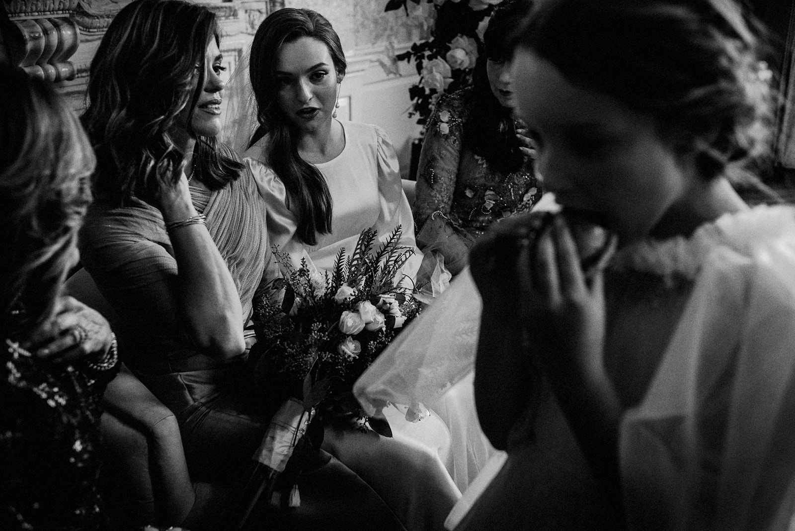 black and white image of bride waiting in the bedeken room at orthodox jewish wedding