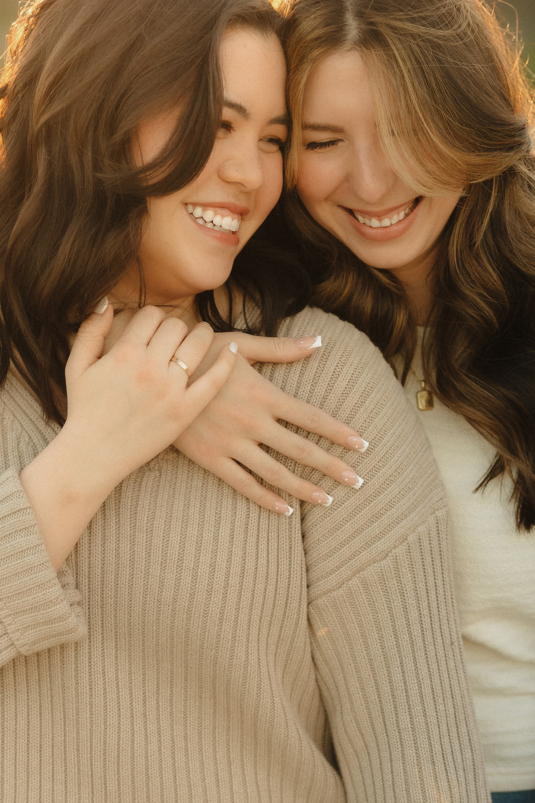 same sex couple hugging during their engagement session