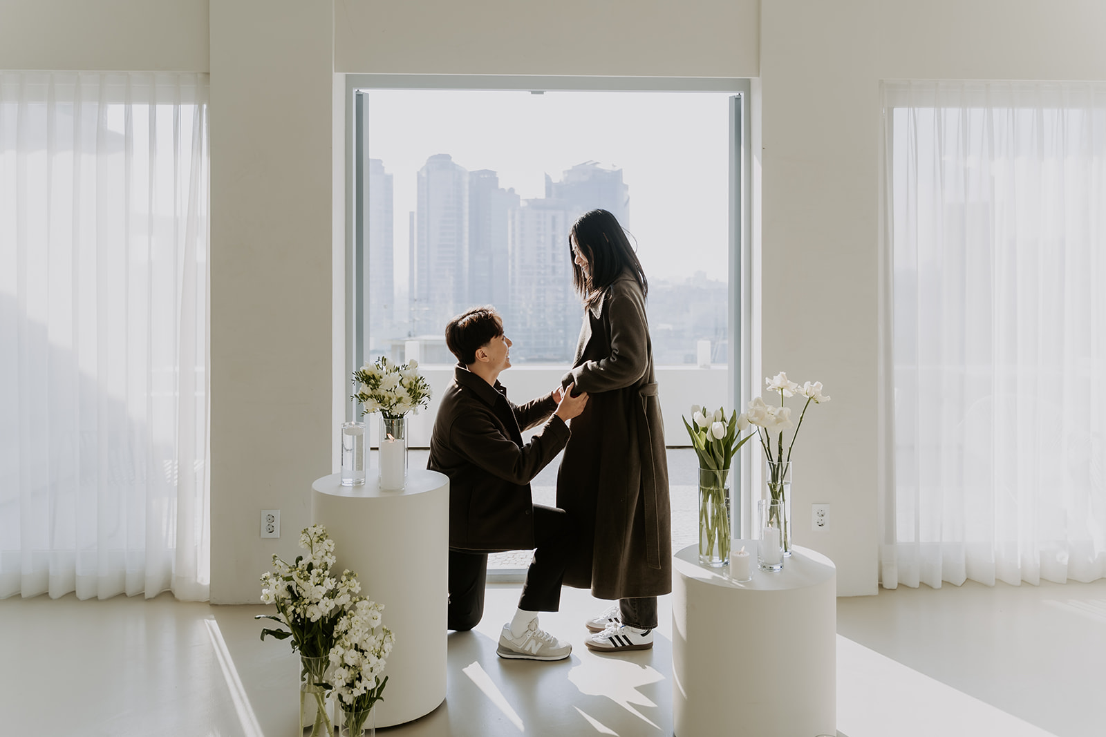 A man proposes to a woman at a photo studio in South Korea