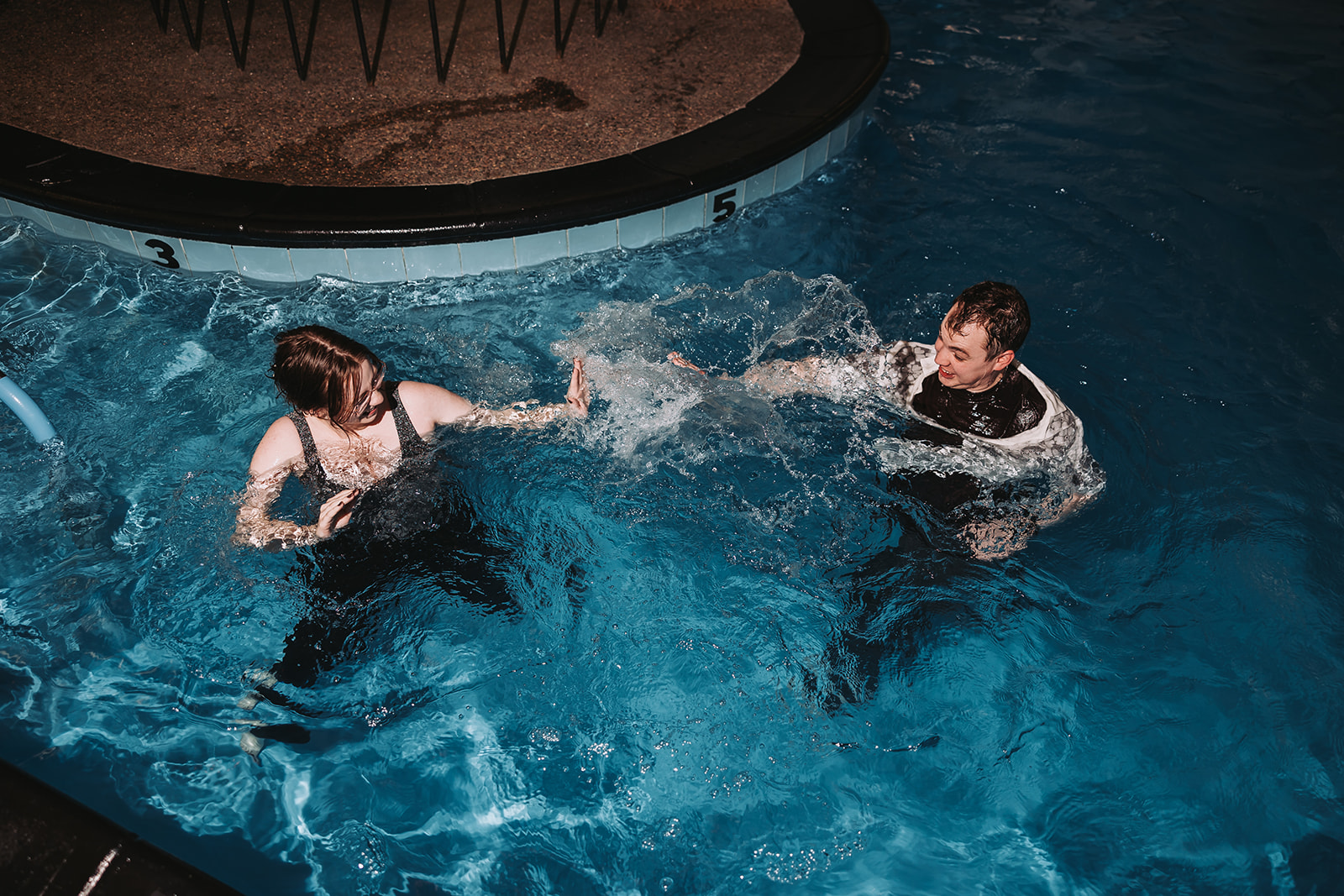 creative engagement session ideas at a pool
