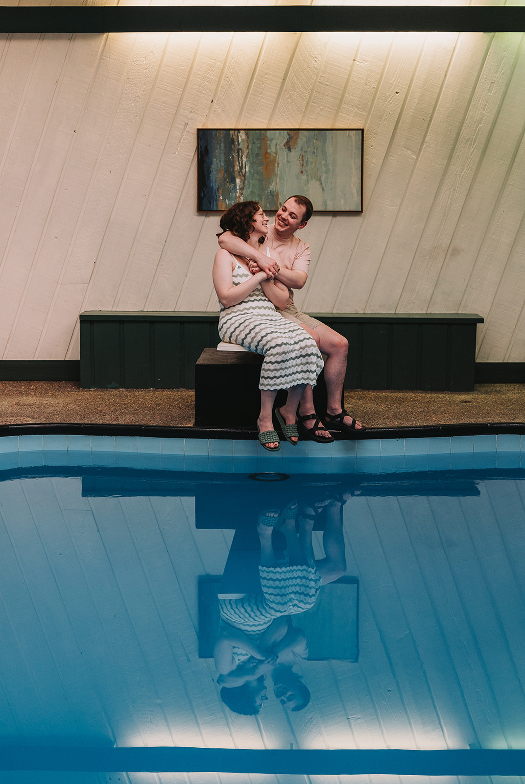 engaged couple on a diving board